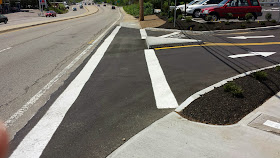 the curb cut on RT 140 allows a right turn into Starbucks and a right turn only exit