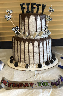 Two-Tiered Cake With 50 at the Top
