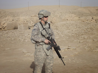 ME standing Guard on Patrol in Iraq