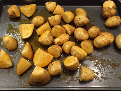 Smoked Paprika Roasted New Potatoes ready to cook on a baking tray