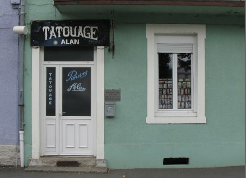 Entrance to a Tatoo Shop in the row of shops in Montceau