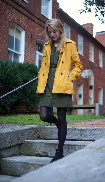 Girl with yellow coat walking down steps