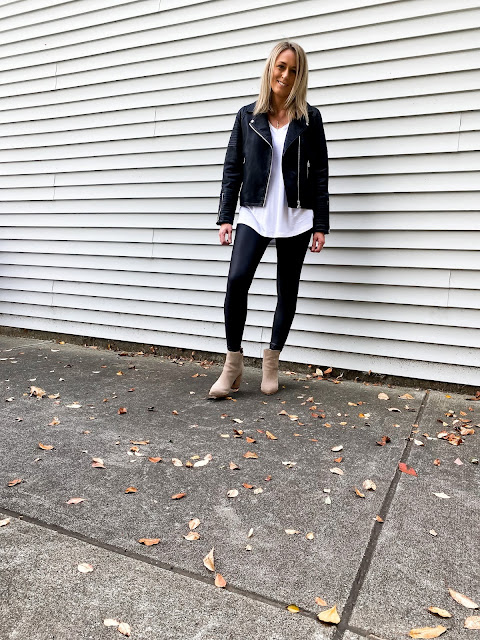 black faux leather jacket and leggings with tan booties