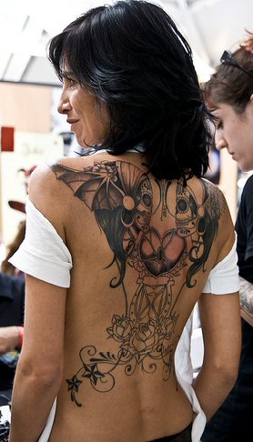 Let's look at three hot tattoos for women today
