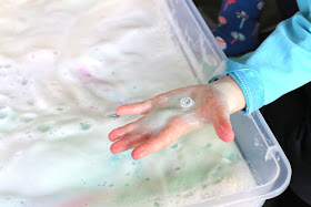 A NEW play recipe:  Magic Foaming Stars.  Add them to your shallow tray and watch as they shoot out rays of colored foam.  Search through the mound of puffy ice cold foam produced to find the treasures once hidden inside.  From Fun at Home with Kids