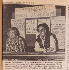 Newspaper photo of table at registration