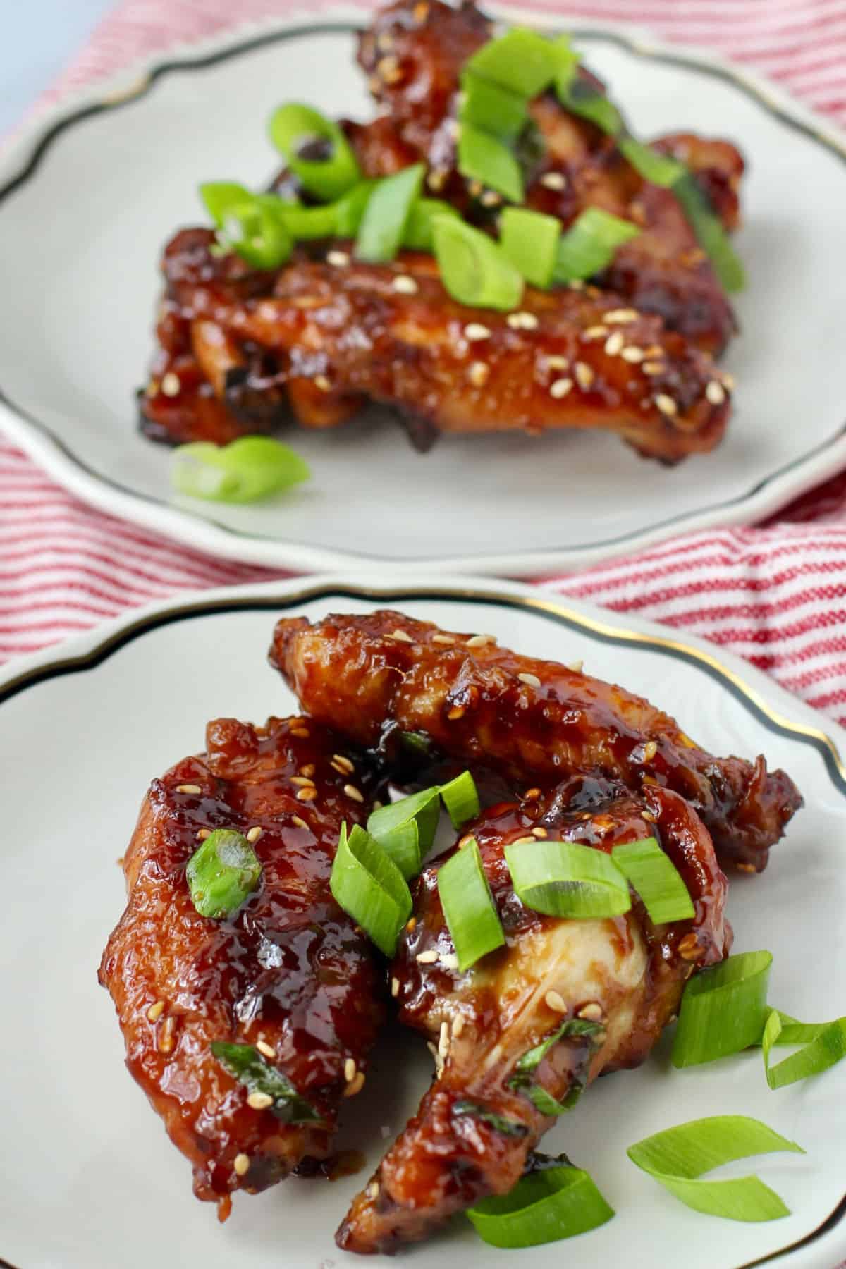 One-Pot Sticky Chicken Wings on two plates.