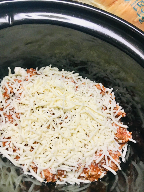 Continue layering meat sauce, noodles and cheese until all ingredients are gone