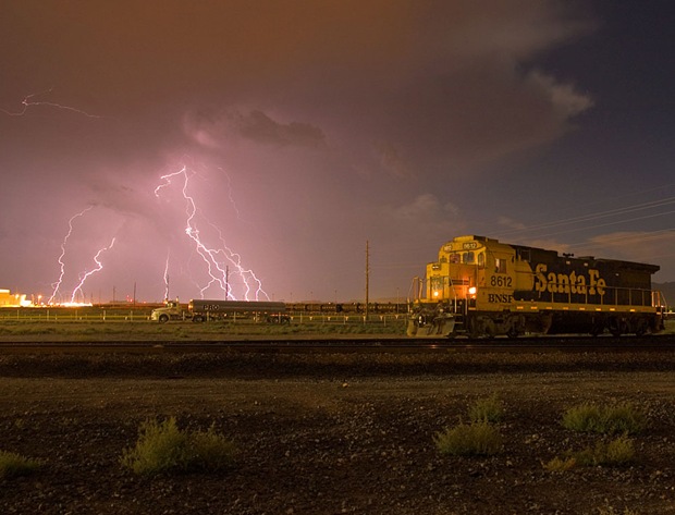 Thunderstorm seen while a rail engine passes through just east of the downtown Kingman area, in Arizona, USA Thunderstorm seen while a rail engine passes through just east of the downtown Kingman area, in Arizona, USA