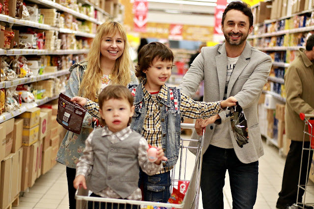 family shopping supermarket parents kids happy