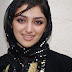 Beautiful girl with brown eyes wearing black scarf