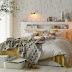 Un dormitorio en dorado y blancoStylish white and gold bedroom