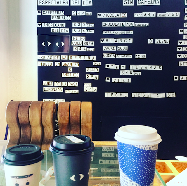 coffee cups and menu at blend station in mexico city