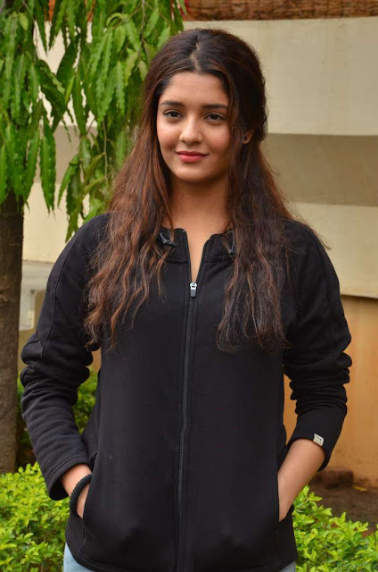 Ritika Singh exudes coolness in a black outfit, showcasing her stylish and confident demeanor.