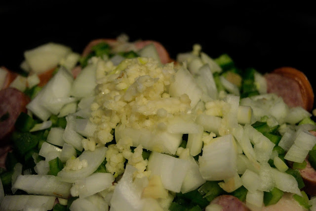 Garlic being added tot he crockpot