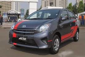 Modifikasi mobil ayla daihatsu m sporty merah putih 