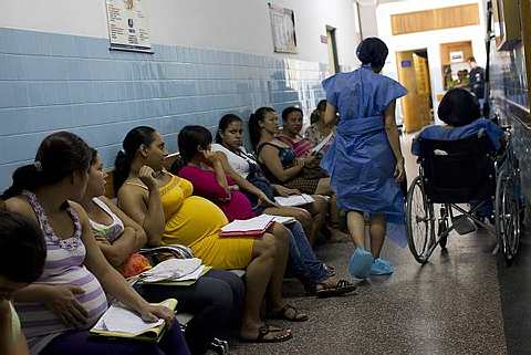 Mothers wait to be admitted to give birth