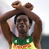Ethiopian marathoner makes protest gesture at finish line