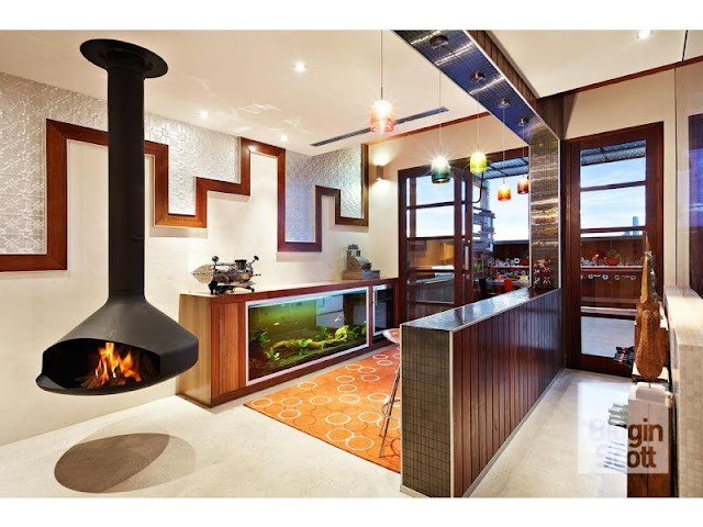 Photo of modern designed area with minimalist black fireplace