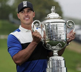 Brooks Koepka survived to win the PGA Championship for a second consecutive year.