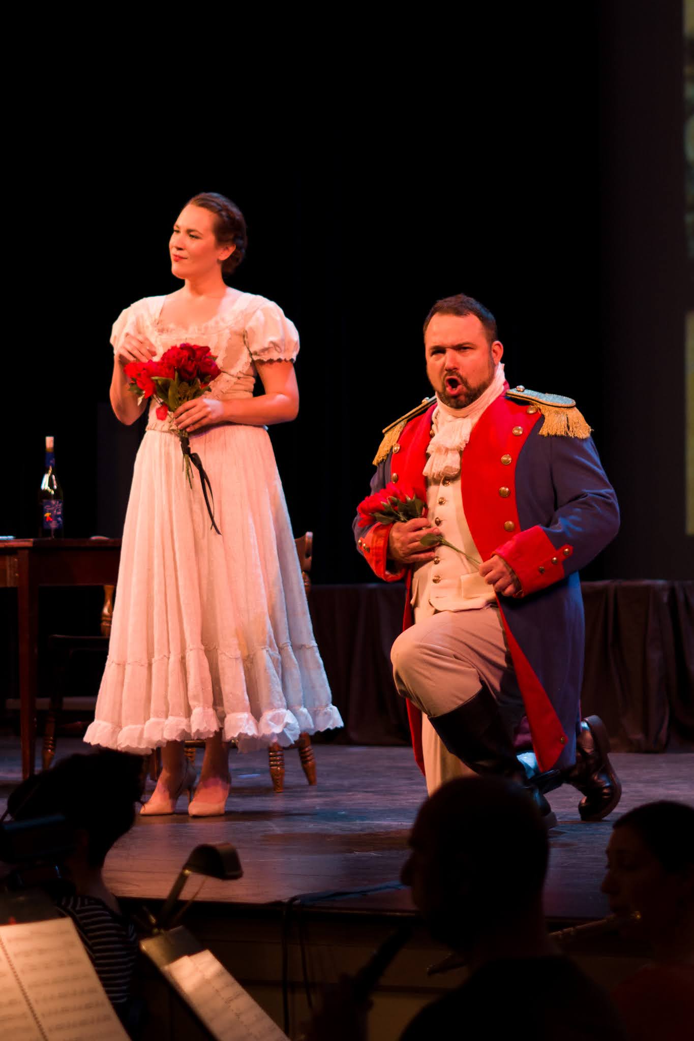 IN REVIEW: soprano CHRISTINE TAYLOR PRICE as Adina (left) and bass-baritone LEO RADOSAVLJEVIC as Belcore (right) in the Emerald Cast of Opera in Williamsburg's September 2021 production of Gaetano Donizetti's L'ELISIR D'AMORE [Photograph © by Diego Valdez; used with permission]