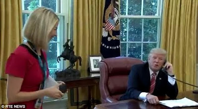 Moment Trump interrupts call to new leader of Ireland to beckon on a "beautiful" Irish female presenter with a "nice smile" 