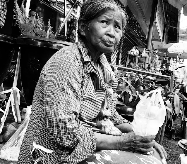 Old Thai woman in market