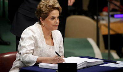 Brazilian president Dilma Rousseff signs the Paris Agreement