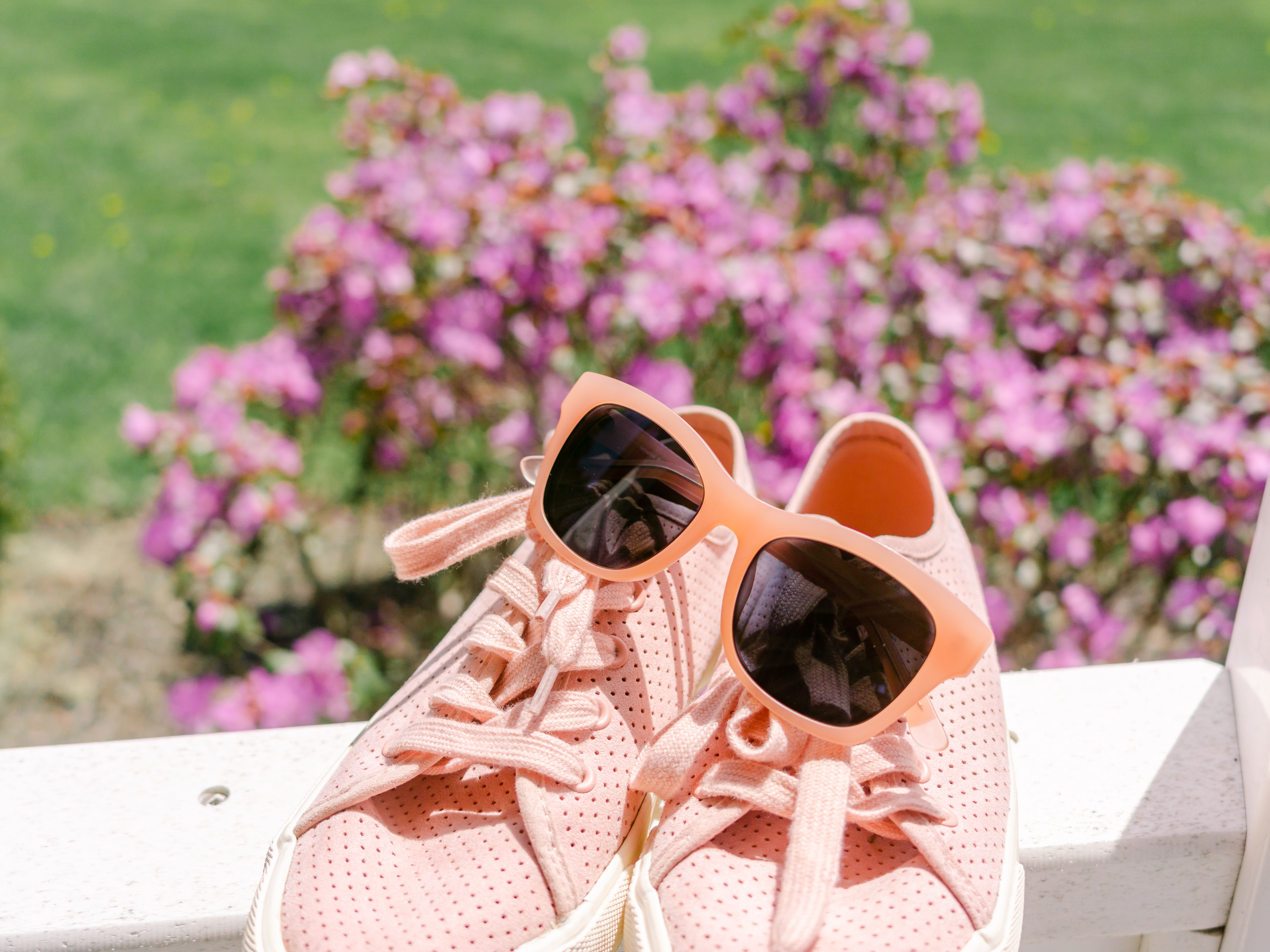 pink sunglasses and pink sneakers