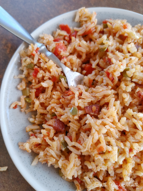 Charleston Red Rice! A Lowcountry recipe popular from Charleston to Savannah, made from rice cooked with bacon and a tomato broth seasoned with peppers and onions perfected by the Gullah and Geechee.