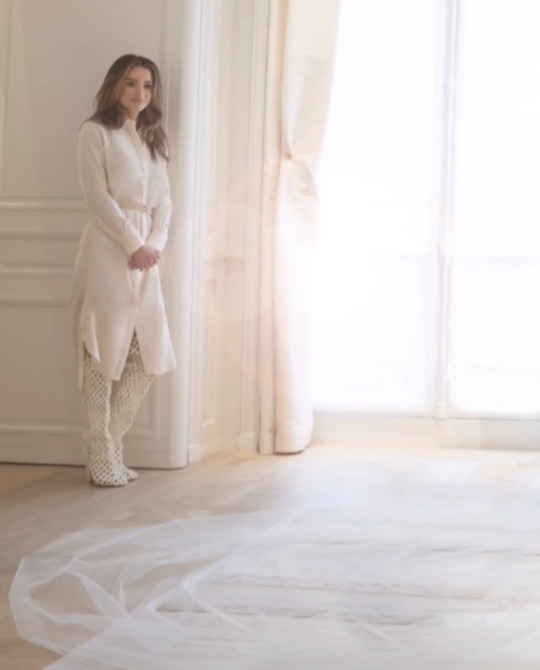 At the end of the video, Queen Rania was seen very emotionally standing in a corner watching Iman during her wedding dress final touches.