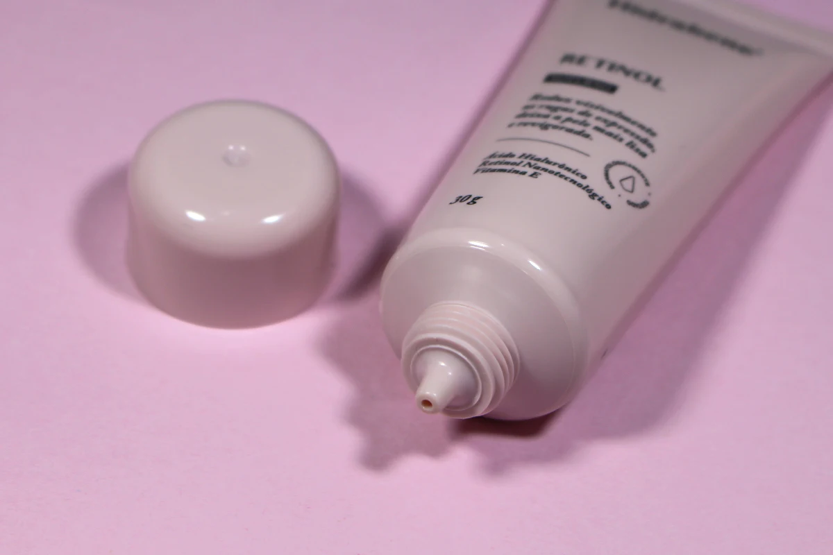 close-up studio of skincare product hidrabene on a plain pink background