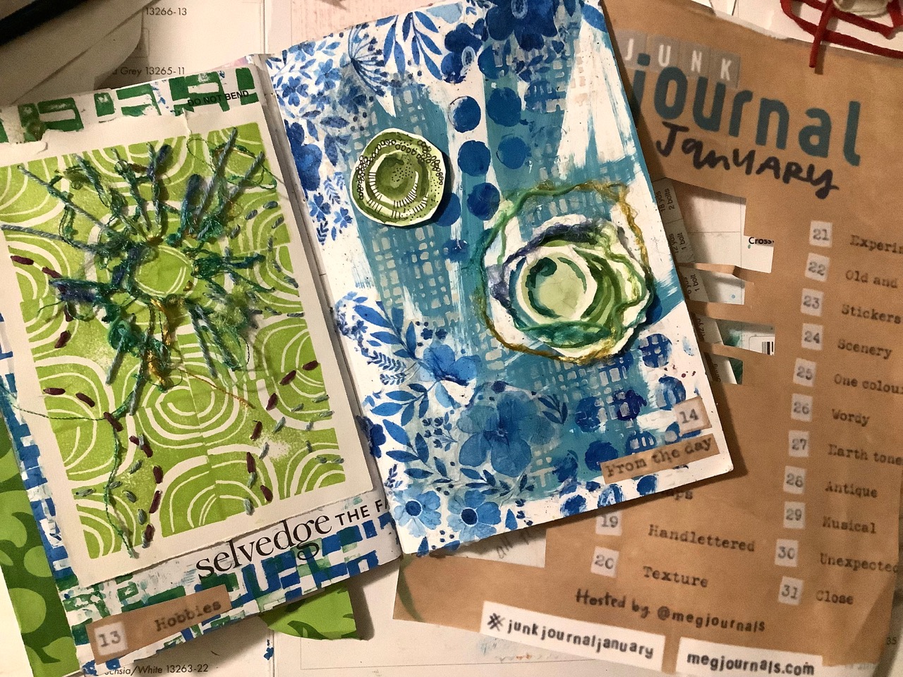 Hand stitching in art journaling with fabric and paper