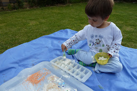 Child doing messy play in the garden