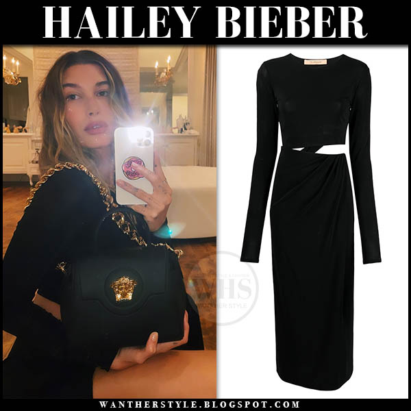 Hailey Bieber in black dress with black gold chain bag