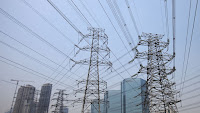 China's electricity grid could be an American science lab's new ground for experiment. (Credit: AP Photo/Andy Wong) Click to Enlarge.