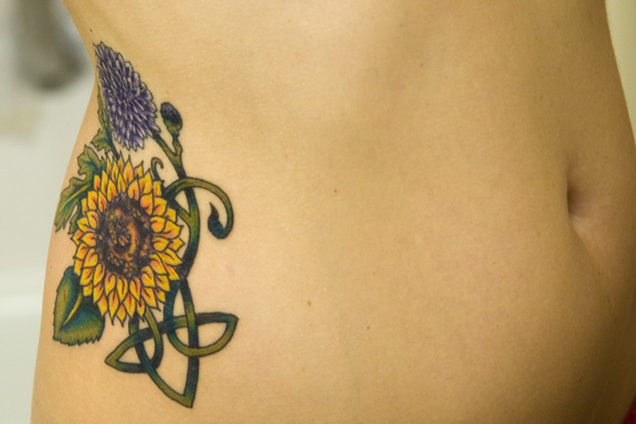 Flower hip tattoos like the ideas featured below are most commonly seen on