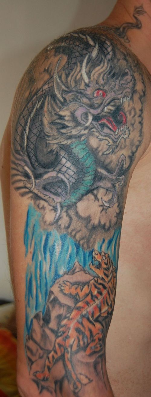 Dragon And Tiger Tattoos Desaign On Arm