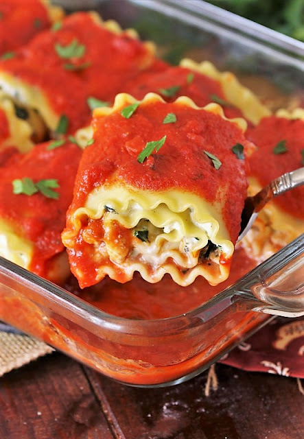 Spinach Lasagna Roll-Ups on Serving Spoon Image