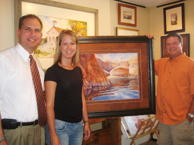 Sullivans with painting of Lake Powell Cliffs by Roland Lee