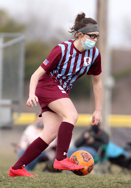 Emily Elsbernd dribbles the ball down the field