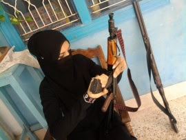 Beautiful arabic girls loading gun