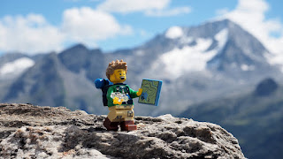 lego minifigure walking in the mountains