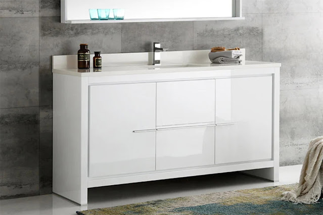Glossy, modern double vanity in a light, airy bathroom.