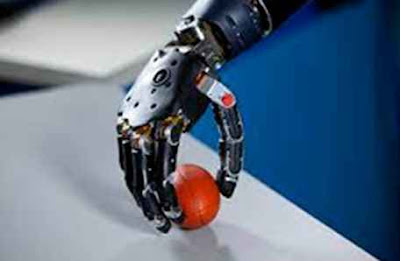 A bionic arms helps a person to grip a ball