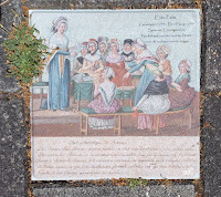 Tegel Etta Palm met zelfde afbeelding als het boek en Franse tekst onderaan