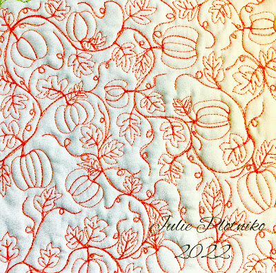 Orange free motion quilted pumpkins and leaves