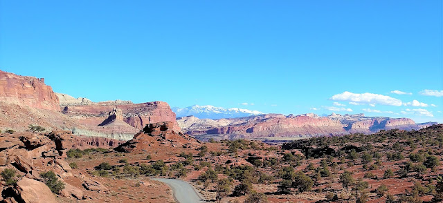 Another wide landscape of mountains, desert, and rocks.