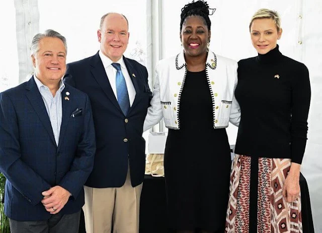 Princess Charlene wore a diamonds printed skirt by Longchamp Paris. Fort Lauderdale Aquatic Centre in Florida