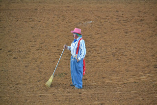 rodeo clown in an arena.